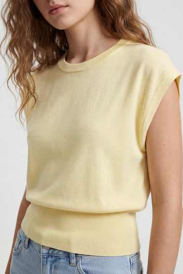 Yellow fine knit sleeveless top with wide ribbed waistband, front view on model