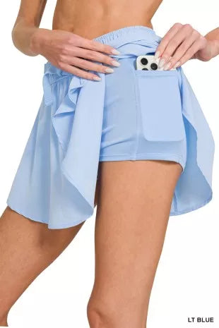 Sky blue women’s athletic skort with built-in shorts and drawstring waist