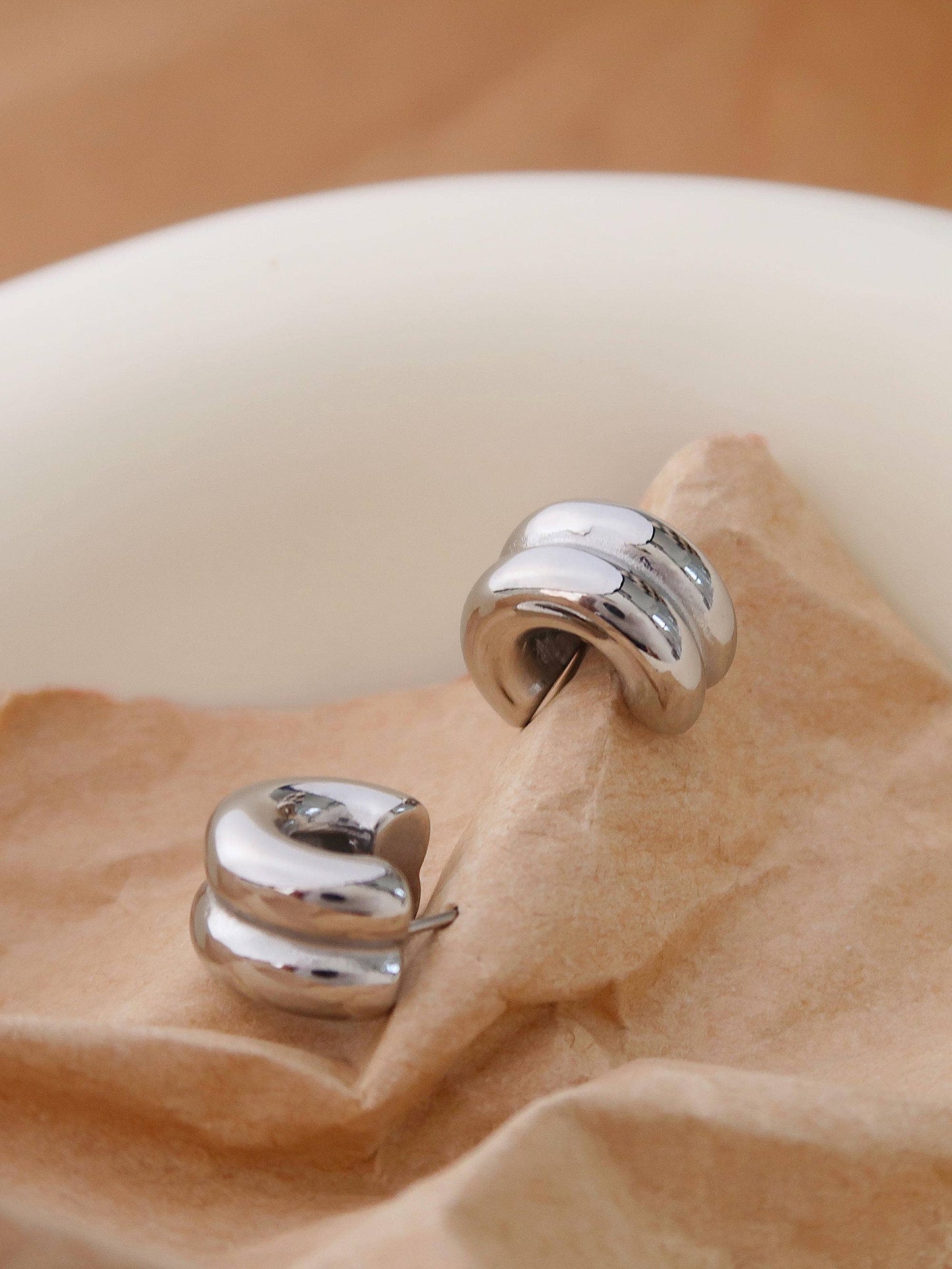 Close-up of Emma silver double C-hoop earring — hypoallergenic stainless steel jewelry

