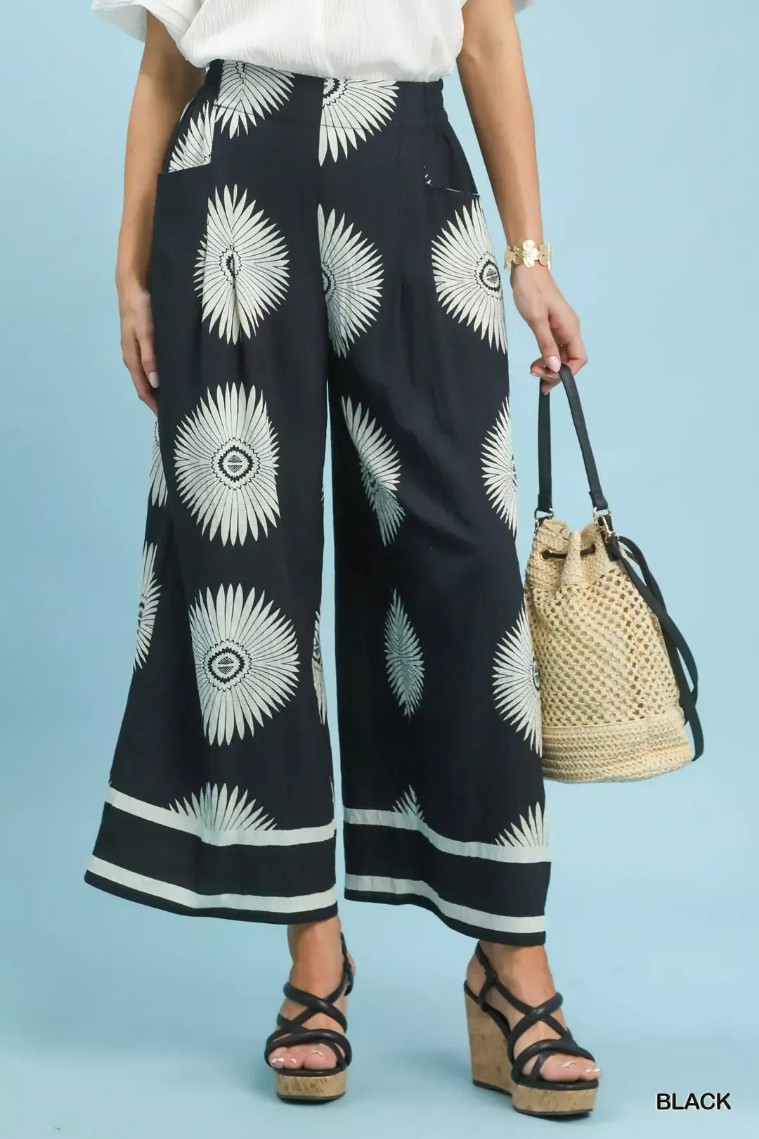 Effortless boho-inspired wide leg pants with an elevated black and white abstract border print.