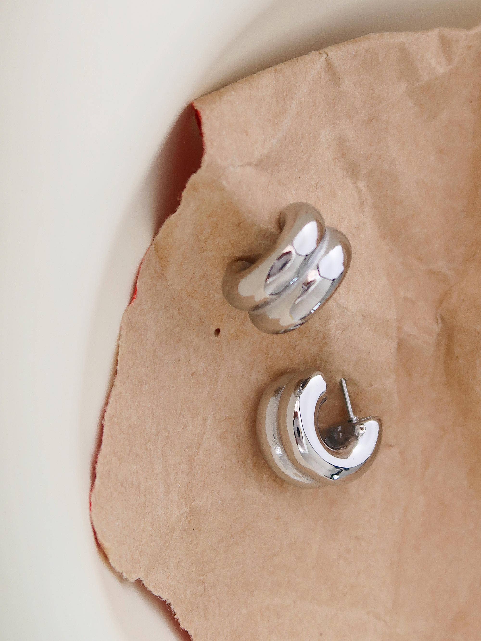 Silver double C-hoop earrings on white background — stainless steel, non-tarnish
