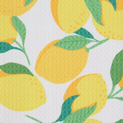 Pattern of yellow lemons with green leaves on a white background