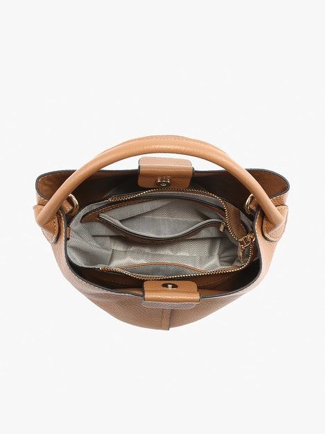 Brown leather handbag with a handle on a white background