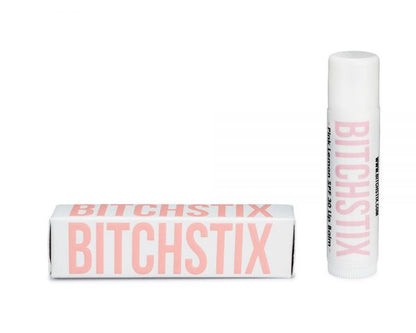 Bitchstix lip balm with packaging on a white background