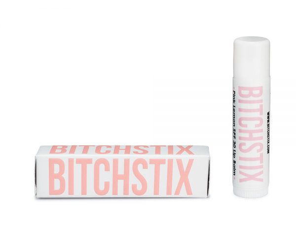 Bitchstix lip balm with packaging on a white background